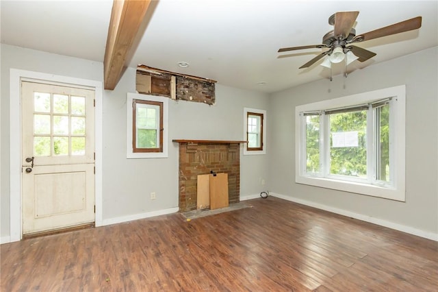 1017 Olive Ave, Natrona Hts/Harrison Twp, PA 15065 - unfurnished living room featuring a fireplace, baseboards, wood finished floors, ceiling fan, and beam ceiling