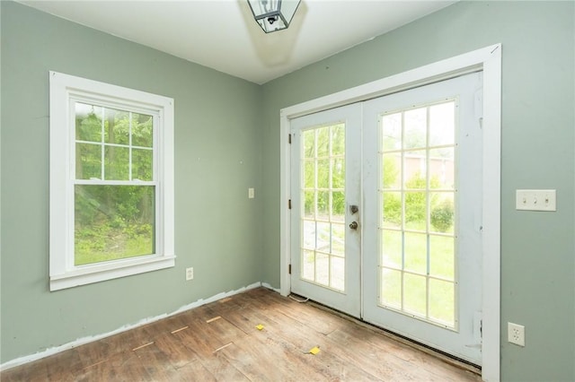 1017 Olive Ave, Natrona Hts/Harrison Twp, PA 15065 - doorway with healthy amount of natural light, french doors, and wood finished floors