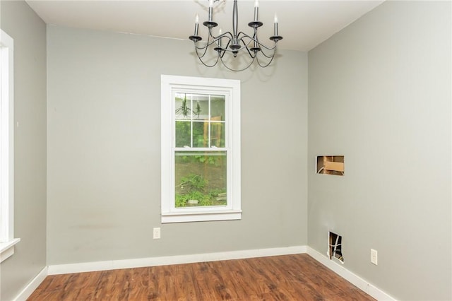1017 Olive Ave, Natrona Hts/Harrison Twp, PA 15065 - empty room with a chandelier, wood finished floors, and baseboards