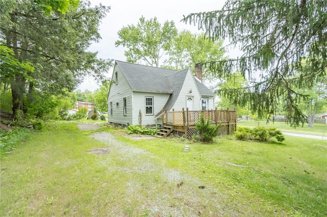 1017 Olive Ave, Natrona Hts/Harrison Twp, PA 15065 - back of house featuring a chimney, a deck, a lawn, and roof with shingles
