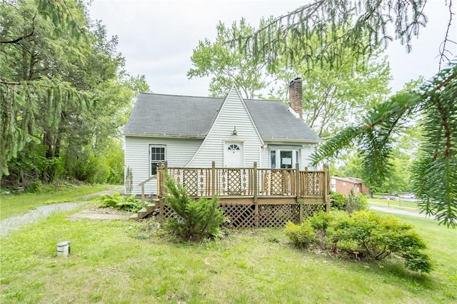 1017 Olive Ave, Natrona Hts/Harrison Twp, PA 15065 - rear view of property featuring a chimney, a deck, a yard, and roof with shingles