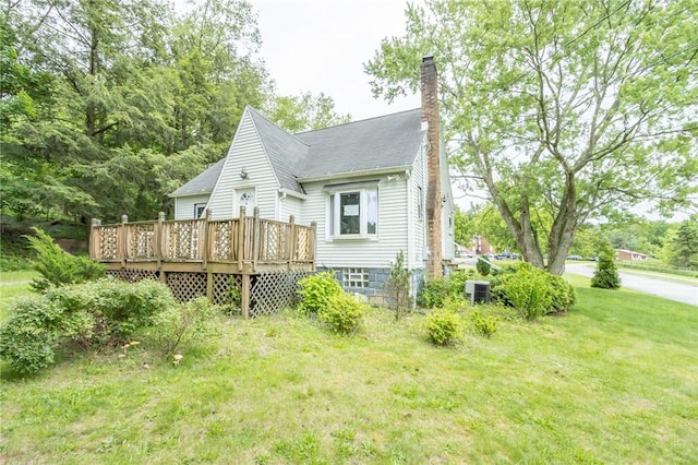 1017 Olive Ave, Natrona Hts/Harrison Twp, PA 15065 - back of house with a chimney, a deck, and a yard