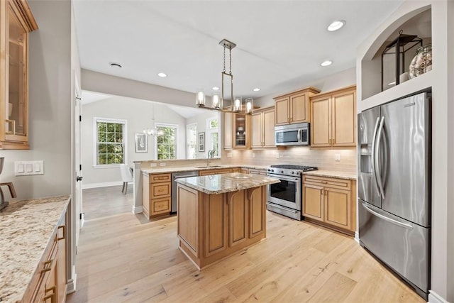 3602 Senate Ct, Adams Twp, PA 16059 - kitchen with appliances with stainless steel finishes, a chandelier, a peninsula, tasteful backsplash, and light wood-style flooring