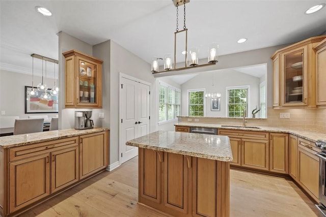 3602 Senate Ct, Adams Twp, PA 16059 - kitchen with a sink, a peninsula, a chandelier, light stone counters, and recessed lighting