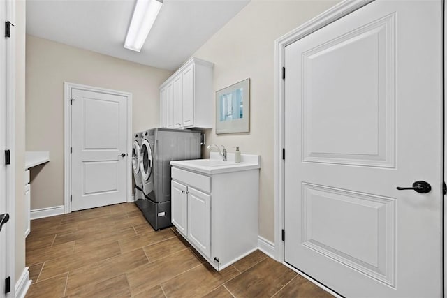 3602 Senate Ct, Adams Twp, PA 16059 - laundry room with washer and clothes dryer, cabinet space, wood finish floors, and baseboards