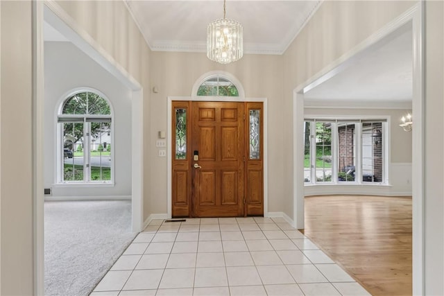 131 Hidden Valley Rd, Murrysville, PA 15146 - entrance foyer with a chandelier, crown molding, light carpet, baseboards, and light tile patterned floors
