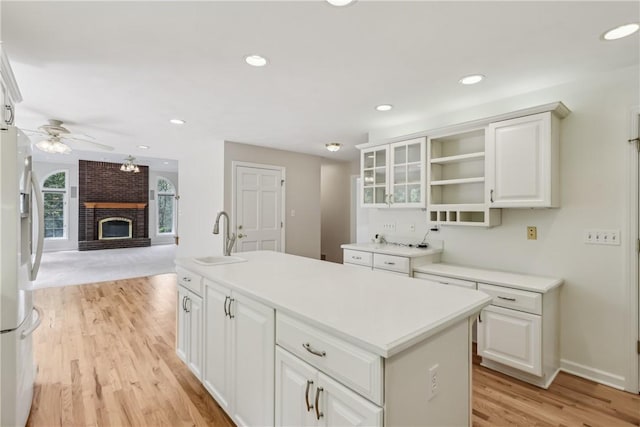 131 Hidden Valley Rd, Murrysville, PA 15146 - kitchen with a sink, fridge with ice dispenser, light wood-style floors, ceiling fan, and a kitchen island