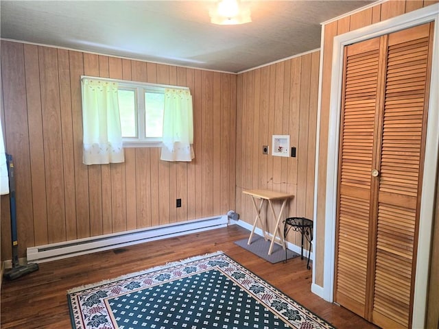 1126 Slate Point Rd, Parks Twp, PA 15690 - interior space featuring a baseboard heating unit, wood finished floors, baseboards, and wood walls