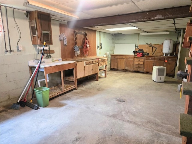 1126 Slate Point Rd, Parks Twp, PA 15690 - unfinished below grade area with a workshop area, a paneled ceiling, and concrete block wall