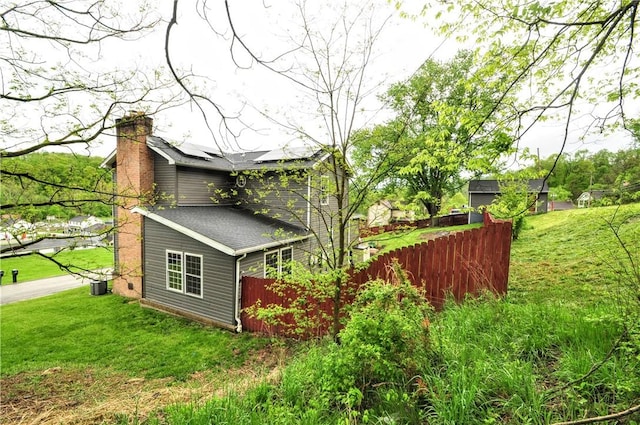 1726 Kennedy, Elizabeth Twp/Boro, PA 15018 - view of property exterior with a chimney, central air condition unit, and roof with shingles