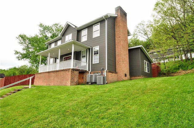 1726 Kennedy, Elizabeth Twp/Boro, PA 15018 - rear view of house with a chimney, a yard, and cooling unit