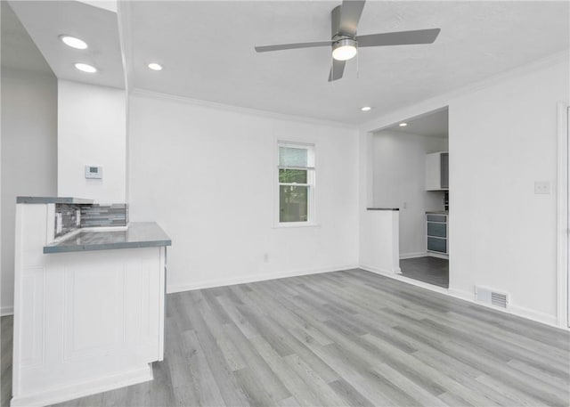 2324 Sheffield Rd, Aliquippa, PA 15001 - unfurnished living room with a ceiling fan, wood finished floors, crown molding, recessed lighting, and baseboards