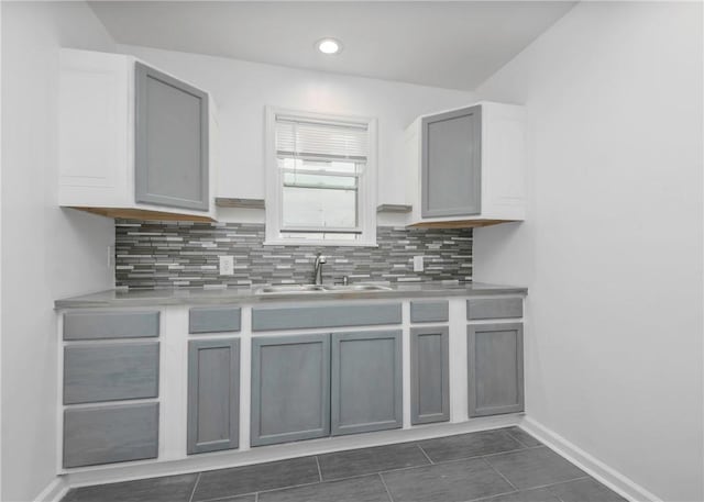 2324 Sheffield Rd, Aliquippa, PA 15001 - kitchen featuring a sink, decorative backsplash, baseboards, gray cabinetry, and recessed lighting