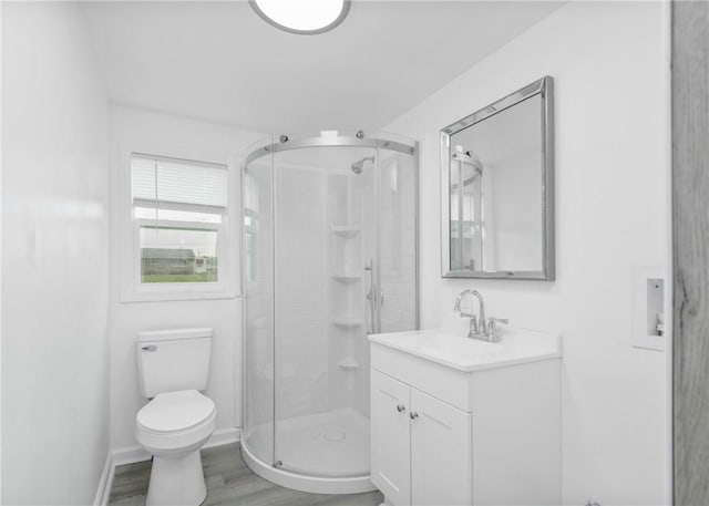 2324 Sheffield Rd, Aliquippa, PA 15001 - full bathroom featuring vanity, a stall shower, toilet, wood finished floors, and baseboards