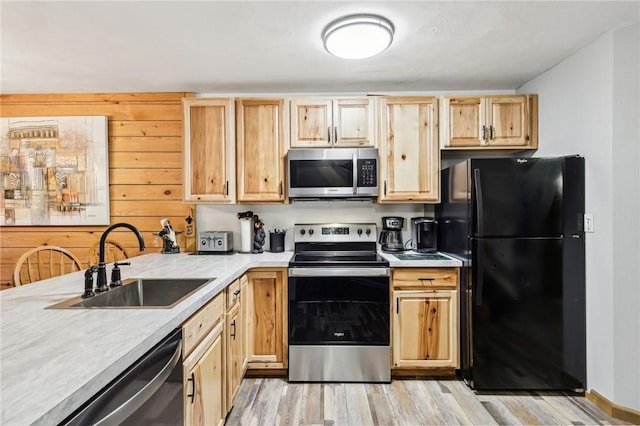 1630 Snowfield Way, Hidden Valley, PA 15502 - kitchen featuring appliances with stainless steel finishes, a sink, light wood finished floors, light countertops, and light brown cabinetry