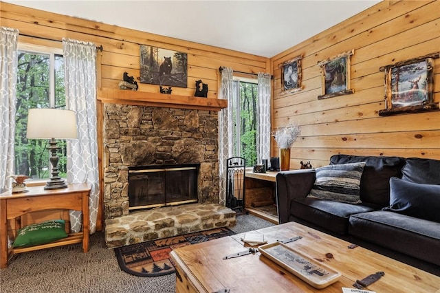 1630 Snowfield Way, Hidden Valley, PA 15502 - carpeted living area featuring plenty of natural light, wood walls, and a stone fireplace