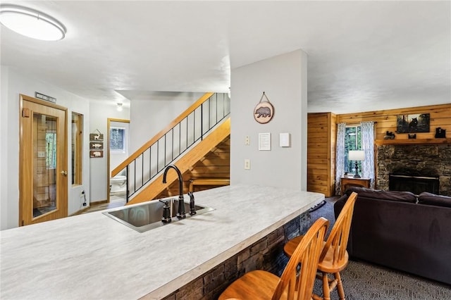 1630 Snowfield Way, Hidden Valley, PA 15502 - dining room with stairs, a stone fireplace, and wood walls