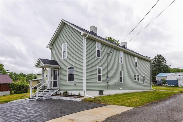 46 Terrace Rd, East Bethlehem, PA 15348 - view of side of home featuring a chimney and a lawn