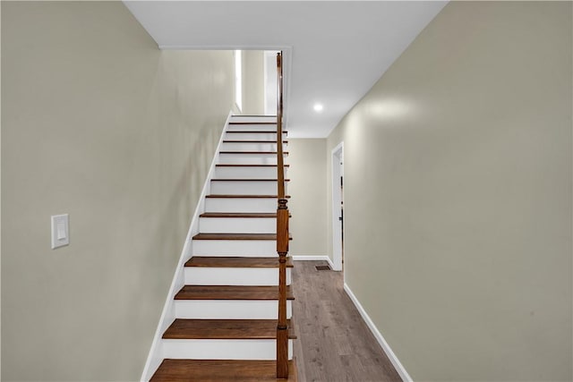 46 Terrace Rd, East Bethlehem, PA 15348 - staircase featuring baseboards, wood finished floors, and recessed lighting