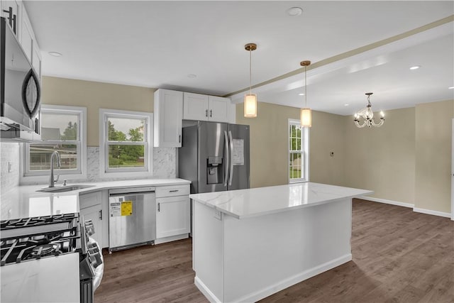 46 Terrace Rd, East Bethlehem, PA 15348 - kitchen featuring stainless steel appliances, a sink, tasteful backsplash, white cabinets, and dark wood-style floors
