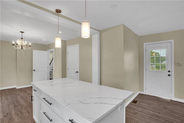 46 Terrace Rd, East Bethlehem, PA 15348 - kitchen with baseboards, dark wood-style flooring, white cabinets, and a chandelier