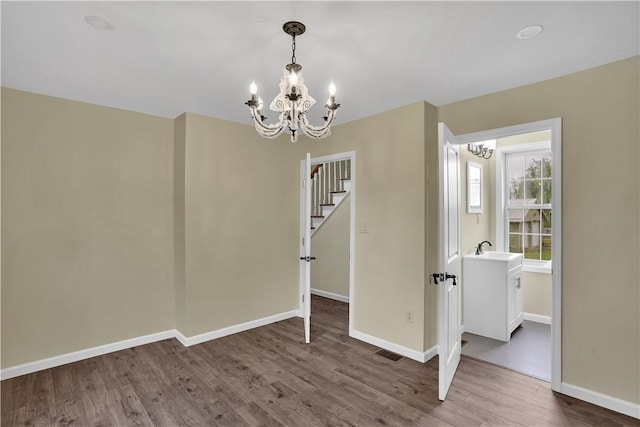 46 Terrace Rd, East Bethlehem, PA 15348 - dining area with a chandelier, wood finished floors, baseboards, and stairs