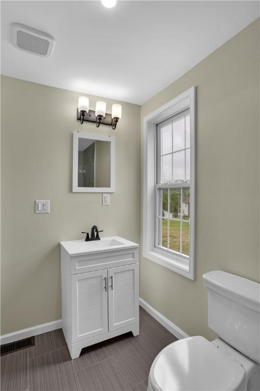 46 Terrace Rd, East Bethlehem, PA 15348 - bathroom featuring baseboards, toilet, and vanity