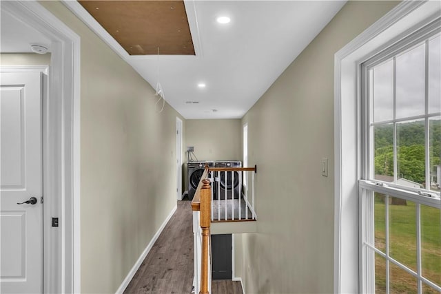 46 Terrace Rd, East Bethlehem, PA 15348 - hallway featuring attic access, wood finished floors, baseboards, an upstairs landing, and washer / clothes dryer