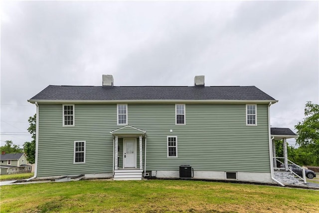 46 Terrace Rd, East Bethlehem, PA 15348 - back of house with entry steps, a yard, central AC, and a chimney