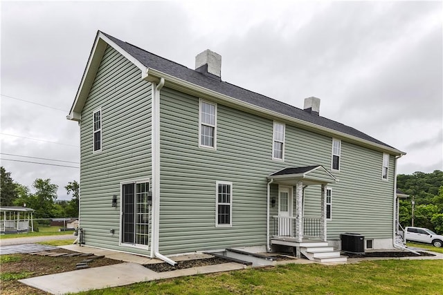 46 Terrace Rd, East Bethlehem, PA 15348 - back of property featuring a chimney and central air condition unit