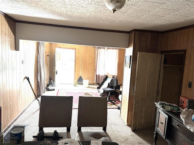 428 2nd St, Donora, PA 15033 - carpeted dining area featuring wood walls and crown molding