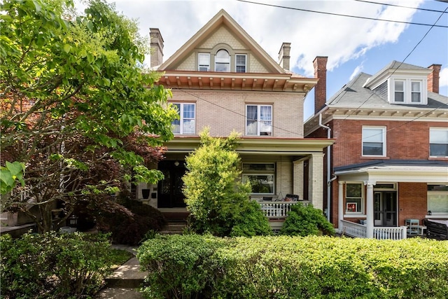 618 Hastings St, Point Breeze, PA 15206 - rear view of house featuring covered porch, brick siding, and a chimney