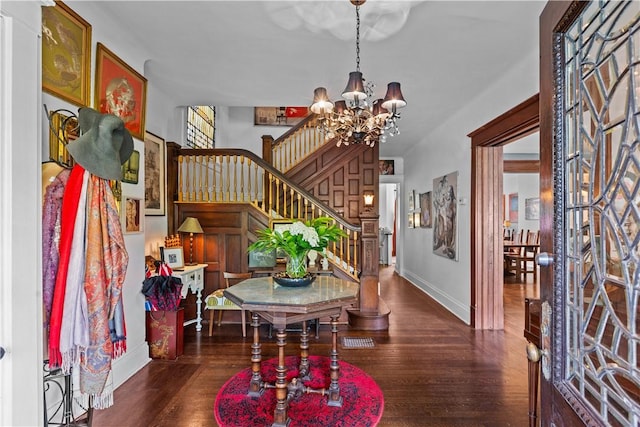 618 Hastings St, Point Breeze, PA 15206 - foyer featuring a chandelier, stairway, baseboards, and wood finished floors