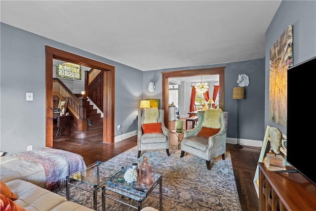 618 Hastings St, Point Breeze, PA 15206 - living room with a chandelier, stairway, baseboards, and wood finished floors