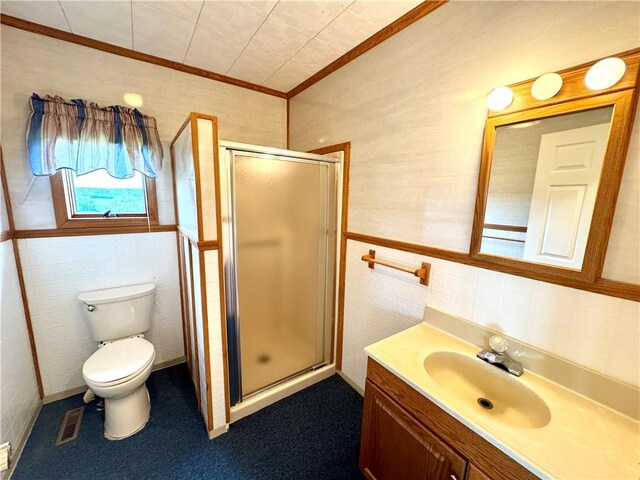 152 Aviator Ln, Somerset Twp, PA 15541 - bathroom with tile walls, crown molding, a stall shower, vanity, and toilet