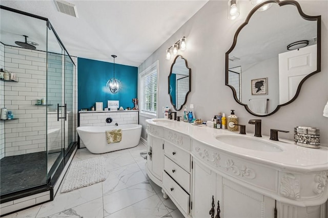 8426 David Dr, South Fayette, PA 15017 - full bathroom featuring a shower stall, marble look tiles, double vanity, and a freestanding tub