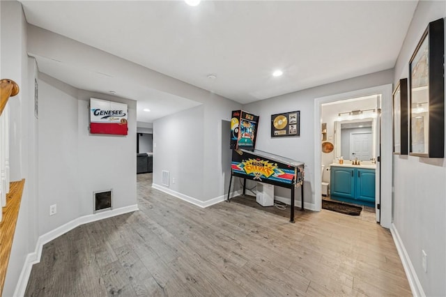 8426 David Dr, South Fayette, PA 15017 - playroom with light wood finished floors, baseboards, recessed lighting, and a fireplace