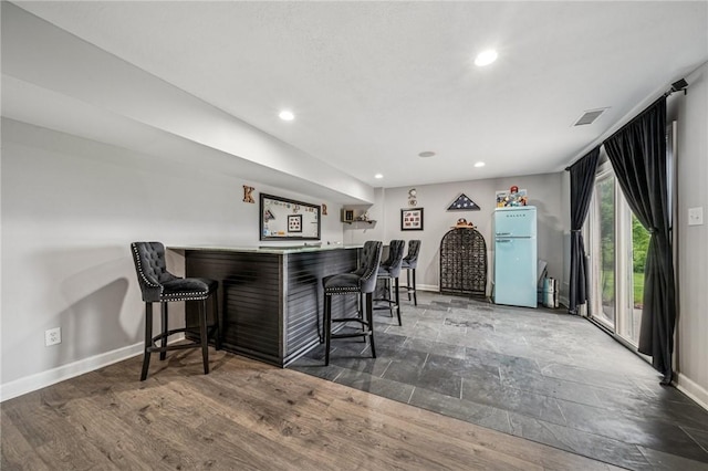 8426 David Dr, South Fayette, PA 15017 - indoor dry bar featuring freestanding refrigerator, baseboards, recessed lighting, and wood finished floors