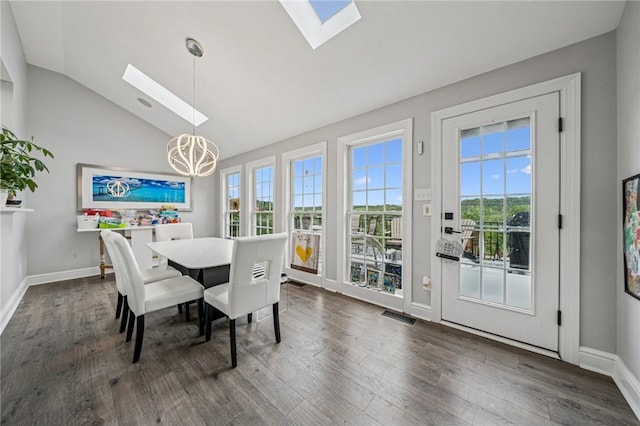 8426 David Dr, South Fayette, PA 15017 - dining area with a skylight, a chandelier, lofted ceiling, healthy amount of natural light, and dark wood finished floors