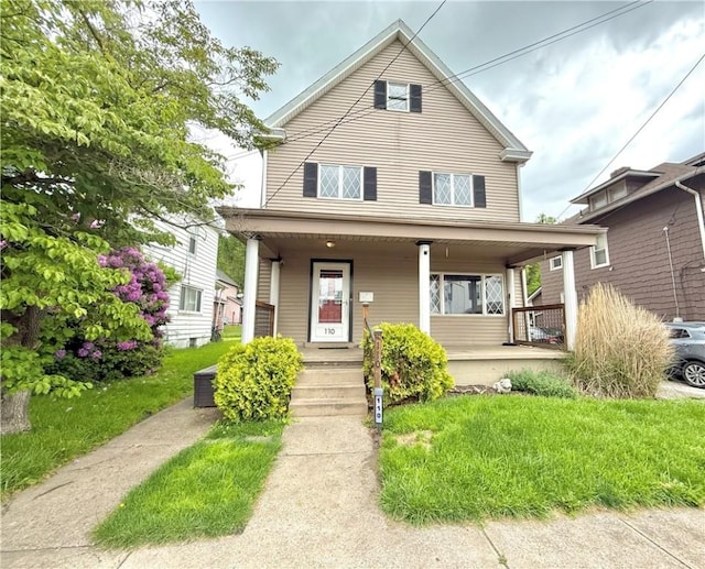110 W Madison Ave, New Castle/7Th, PA 16102 - view of front of house featuring covered porch and a front yard