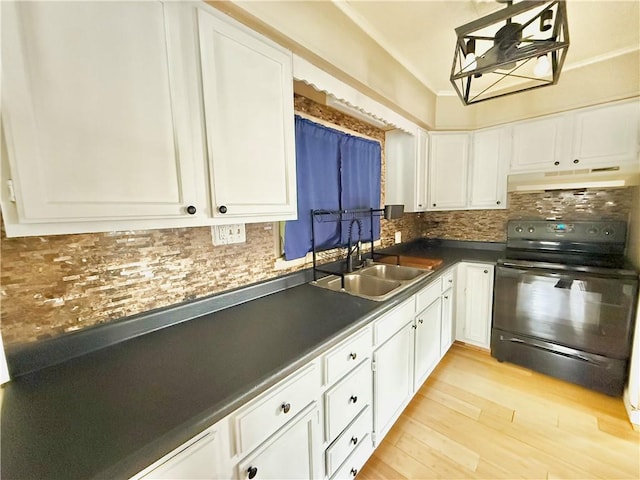 110 W Madison Ave, New Castle/7Th, PA 16102 - kitchen with black range with electric cooktop, a sink, under cabinet range hood, and white cabinetry