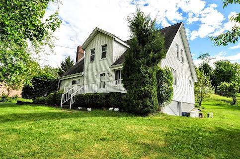 904 Mcclintock Ave, Washington Twp Fay, PA 15012 - rear view of house featuring a yard and a chimney