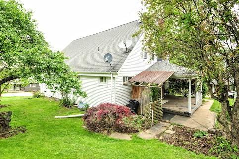 904 Mcclintock Ave, Washington Twp Fay, PA 15012 - back of property with a lawn and a shingled roof