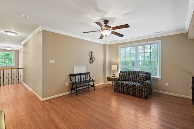 230 Patriot Ln, Economy, PA 15042 - living area with crown molding, a ceiling fan, wood finished floors, and baseboards