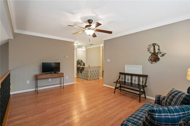 230 Patriot Ln, Economy, PA 15042 - living area with a ceiling fan, an upstairs landing, crown molding, light wood-style flooring, and baseboards