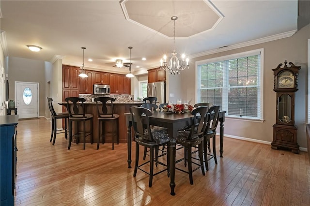 230 Patriot Ln, Economy, PA 15042 - dining space with light wood finished floors, healthy amount of natural light, a chandelier, ornamental molding, and baseboards