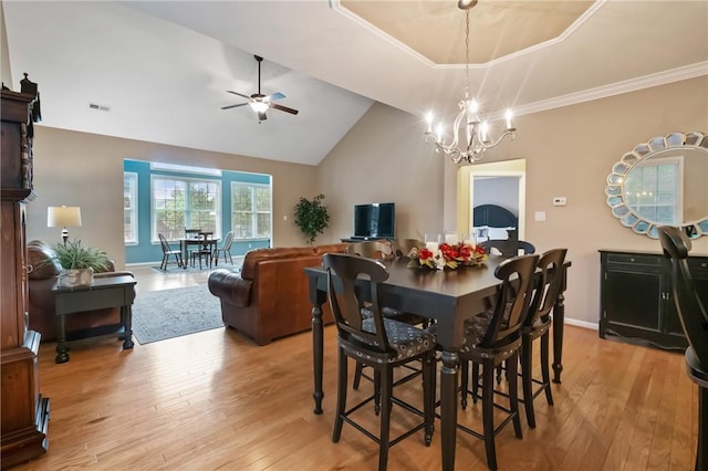 230 Patriot Ln, Economy, PA 15042 - dining space with light wood-style flooring, vaulted ceiling, ceiling fan, a chandelier, and crown molding