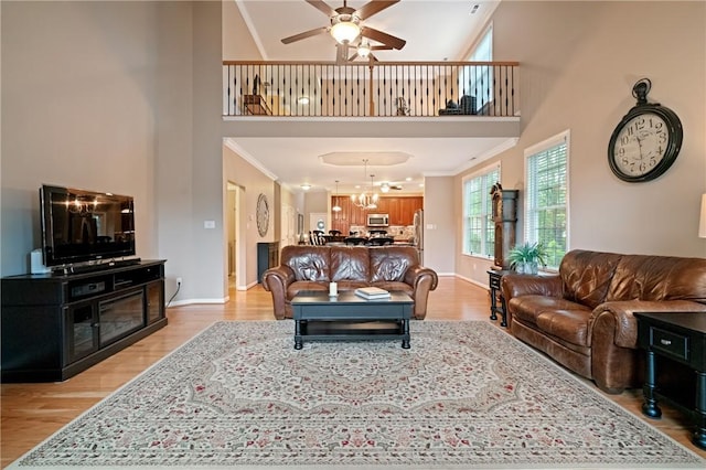 230 Patriot Ln, Economy, PA 15042 - living area with a high ceiling, light wood-type flooring, ceiling fan, a chandelier, and baseboards