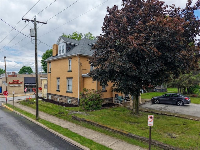 201 Thompson St, Latrobe, PA 15650 - view of property exterior featuring a lawn