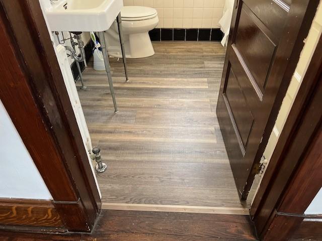 201 Thompson St, Latrobe, PA 15650 - bathroom featuring wood finished floors and toilet